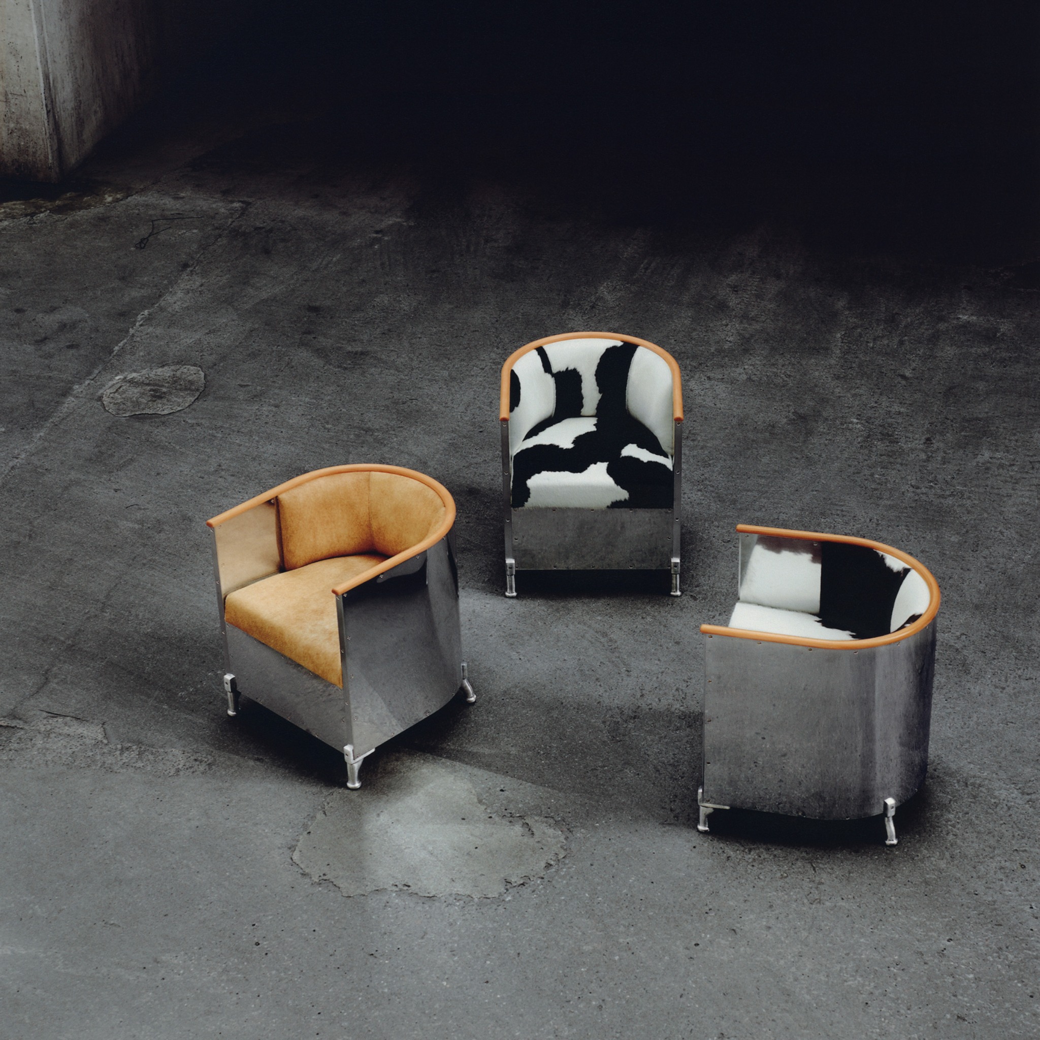 Three Källemo chairs with leather and cowhide upholstery for Nordiska Galleriet