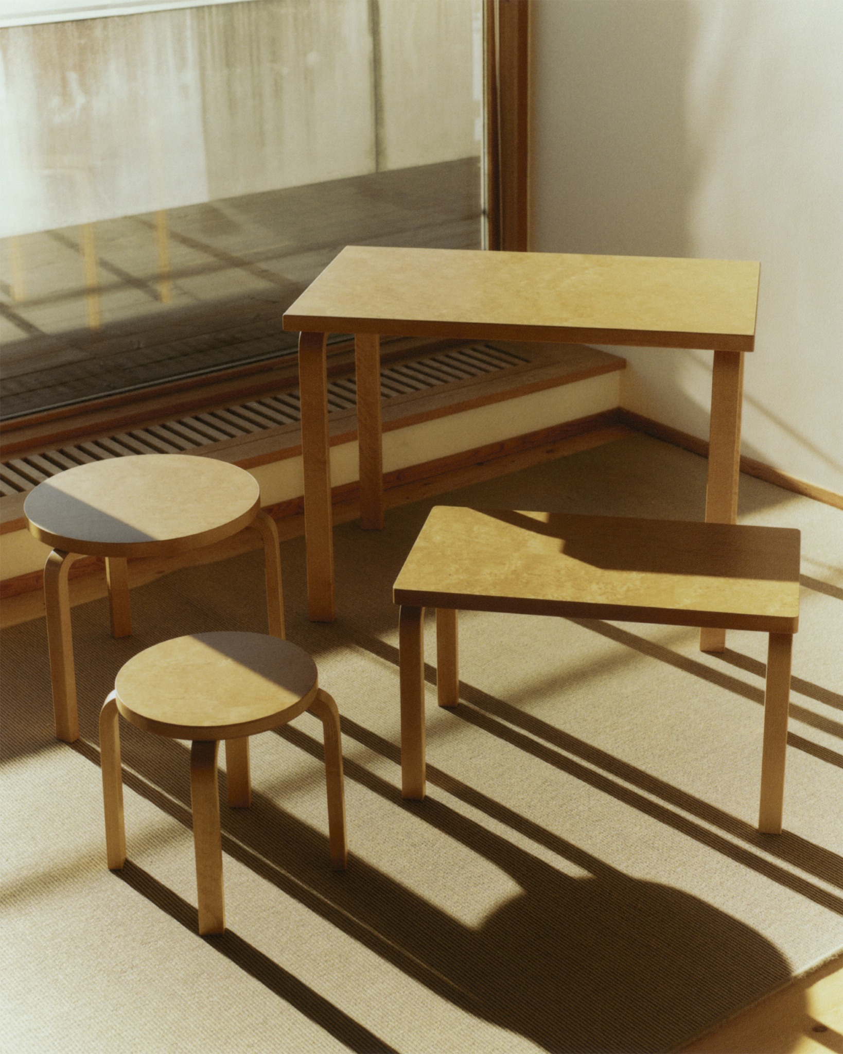 Artek wooden furniture in sunlight at the Finnish Embassy in Stockholm