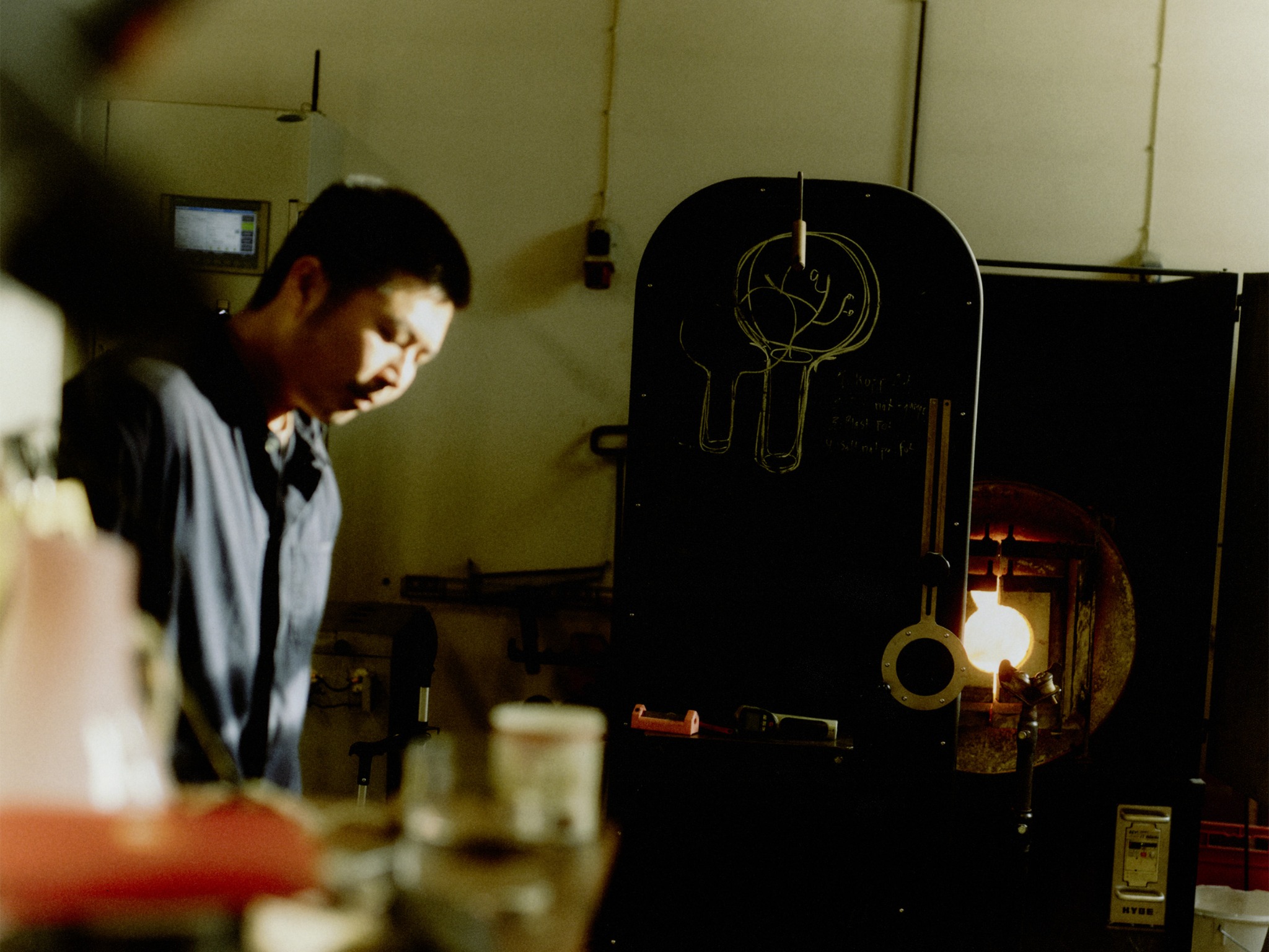 Glass artisan at work in a Stockholm workshop