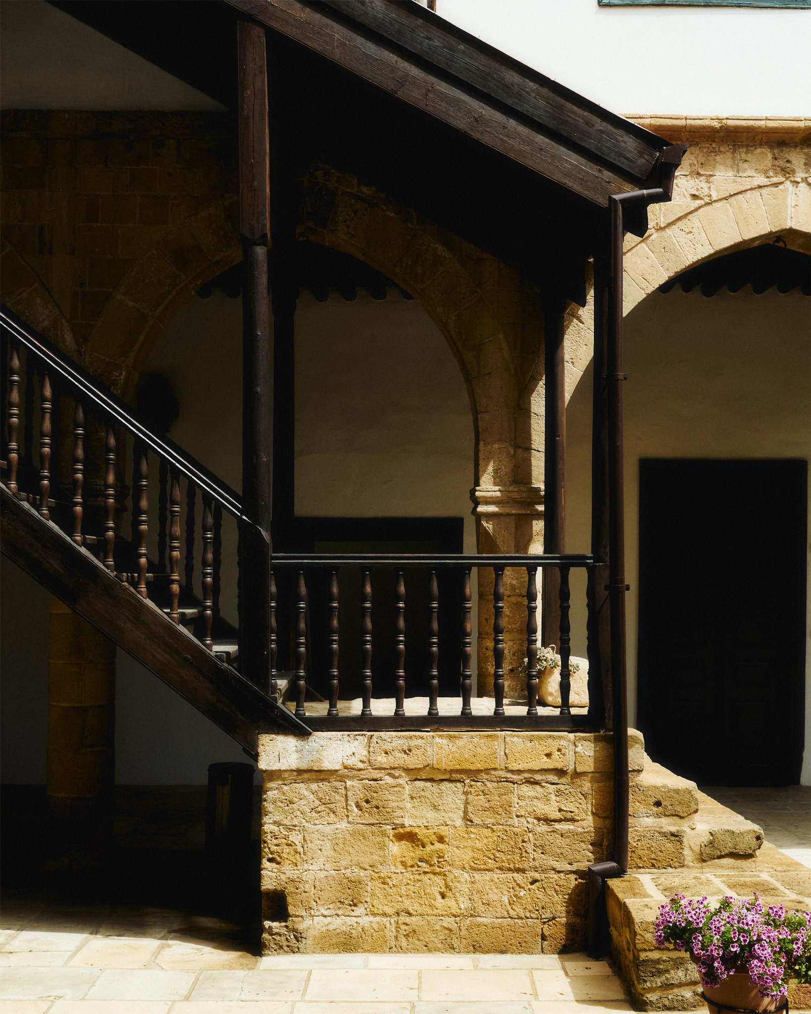 Stone courtyard and wooden veranda in Nicosia